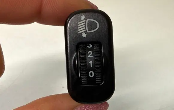 Headlight level height control switch