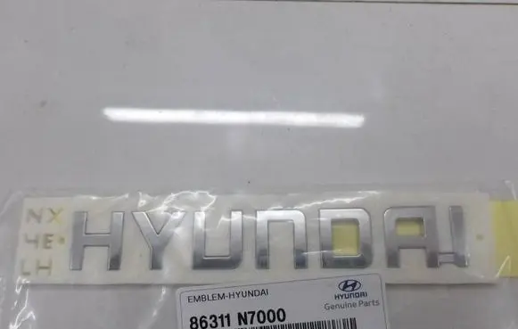 Hyundai Tucson IV NX4 Rear door emblem/model letters 86311N7000