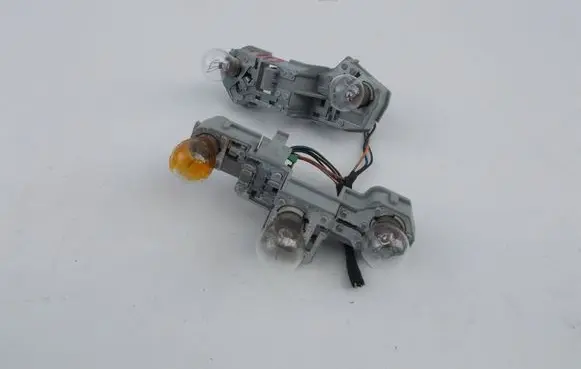 Tail light bulb cover holder