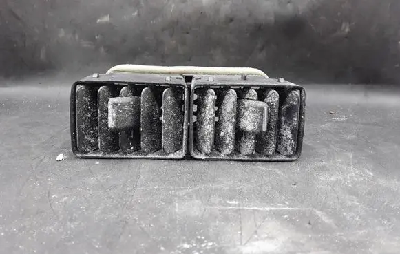 Cadillac SRX Dash center air vent grill 25749648