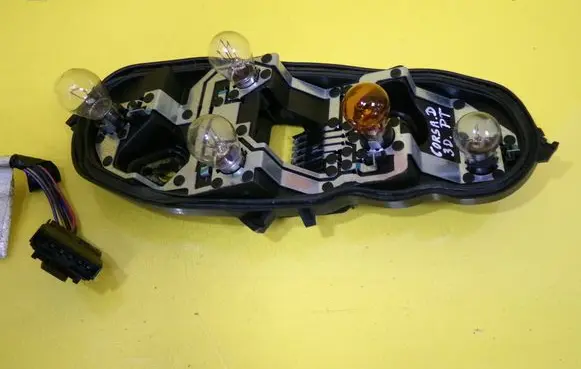 Opel Corsa D Tail light bulb cover holder 89037852A