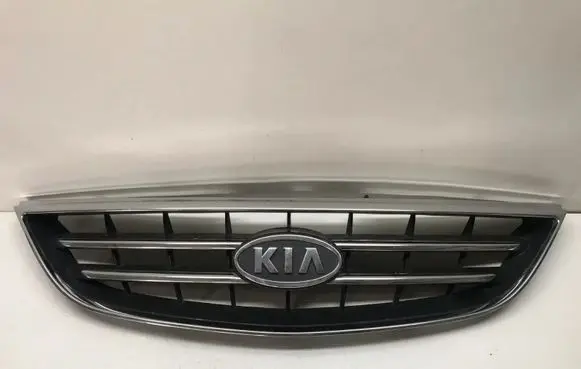 KIA Carens I Front bumper upper radiator grill