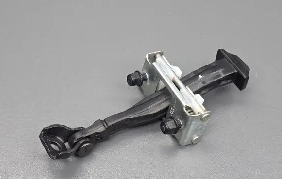 Front door check strap stopper