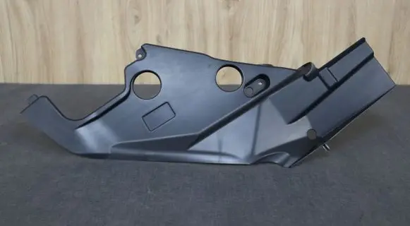 Engine bonnet/hood lock trim molding