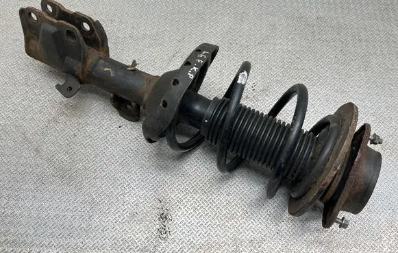 Subaru Legacy Front shock absorber with coil spring