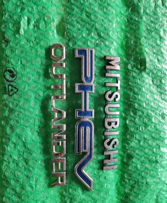 Mitsubishi Outlander Front door emblem/model letters 