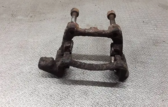 Volkswagen Touran I Brake caliper pad carrier rear 