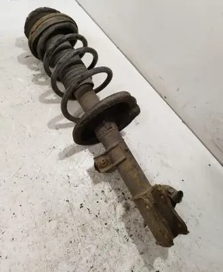 Suzuki Swift I Front shock absorber with coil spring