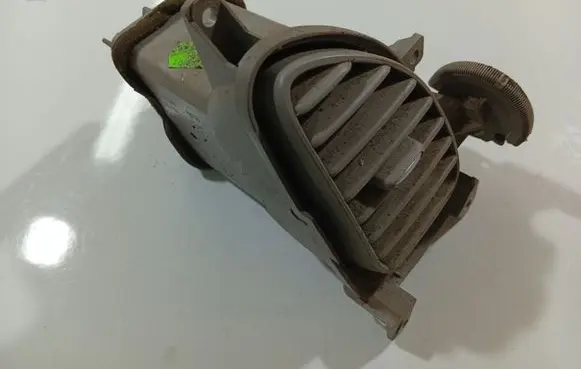 Nissan Almera Tino Dash center air vent grill 68761BU200