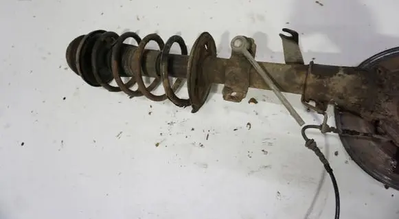 Dacia Duster Front shock absorber with coil spring MCPERSON