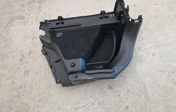 Trunk/boot lower side trim panel