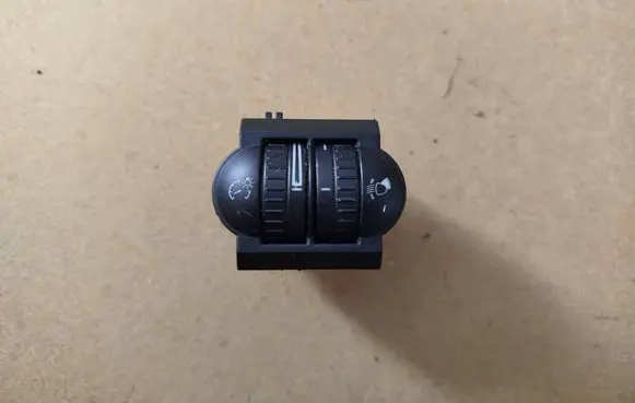 Headlight level height control switch