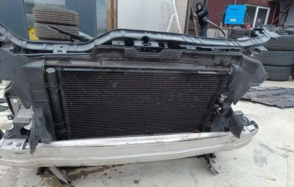 Radiator support slam panel