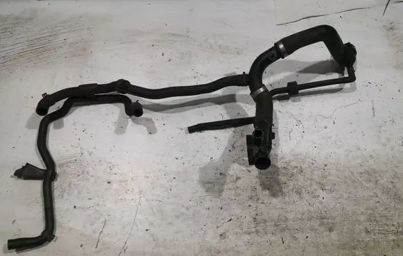 Volkswagen Jetta VI Engine coolant pipe/hose 03L121131AA