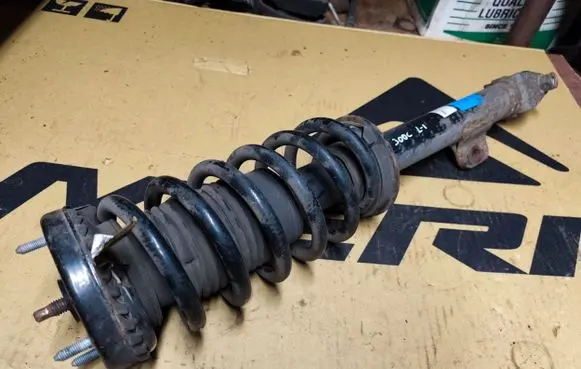 Front shock absorber with coil spring
