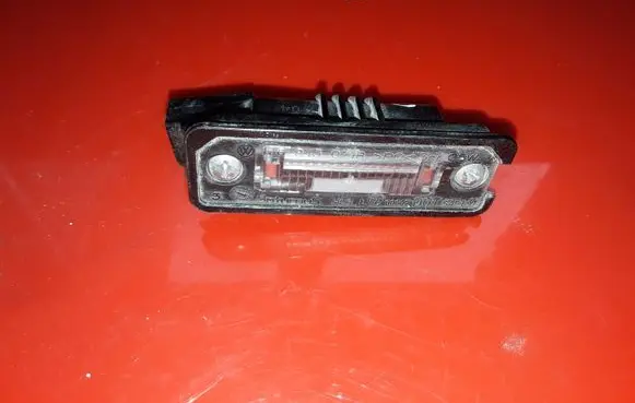 Volkswagen Golf V Number plate light 1J6943021B