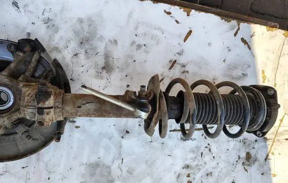 Volkswagen Golf VI Front shock absorber with coil spring