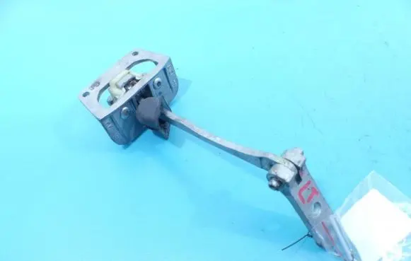 Front door check strap stopper