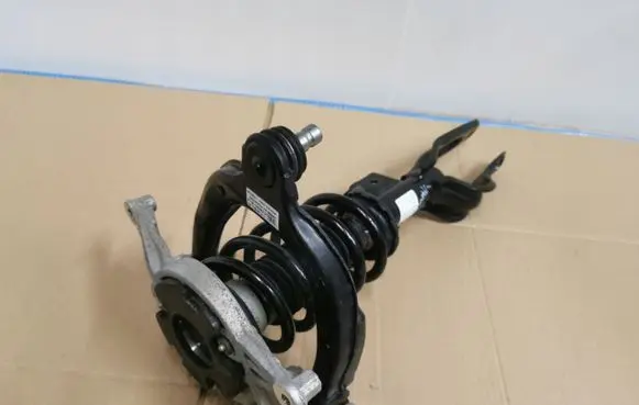 Tesla Model Y Front shock absorber with coil spring 1044368