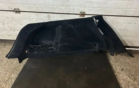 Trunk/boot lower side trim panel