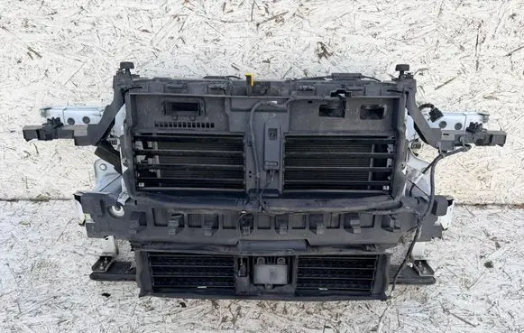 Radiator support slam panel