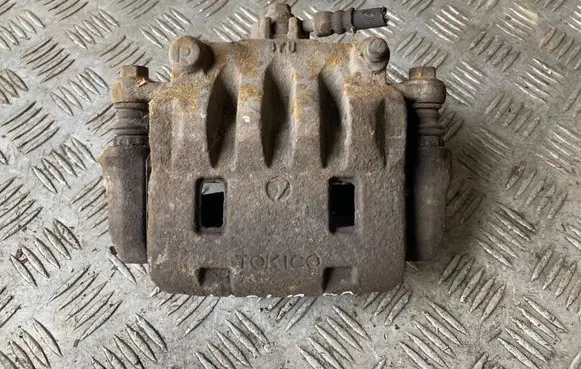 Subaru Impreza III Front brake caliper