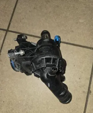Thermostat/thermostat housing