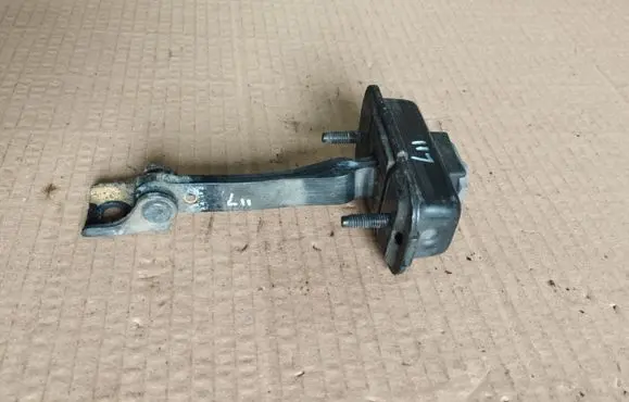 Rear door check strap stopper