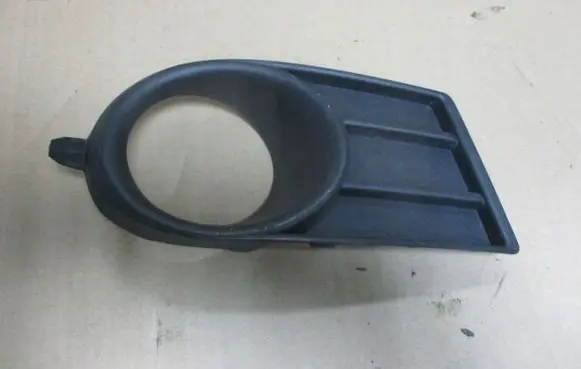 Suzuki Swift I Front fog light trim/grill