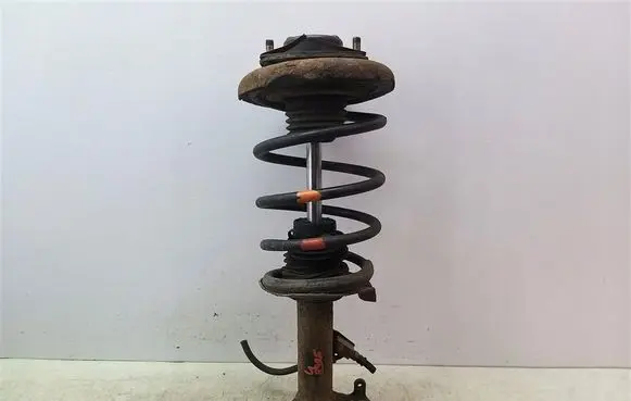 Nissan Primera Front shock absorber with coil spring 