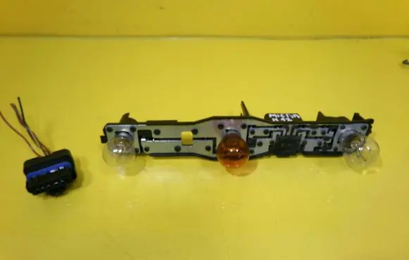Nissan Micra Tail light bulb cover holder 