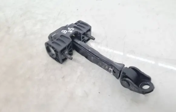 Front door check strap stopper