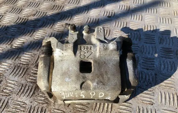Nissan Juke I F15 Front brake caliper