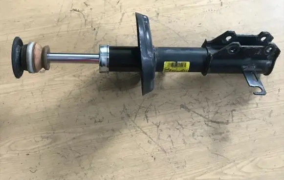 Opel Zafira C Front shock absorber/damper 13474025