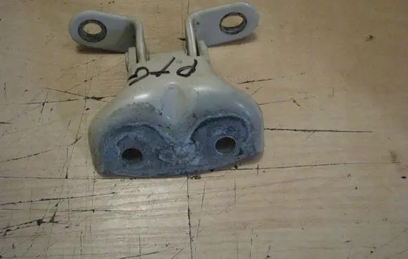 Rear door upper hinge