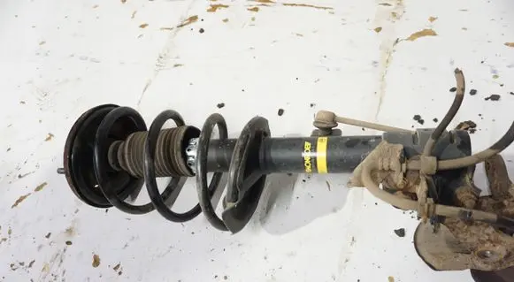 Front shock absorber with coil spring