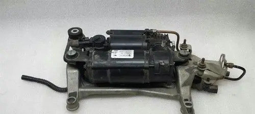 Volkswagen Touareg I Air suspension compressor/pump 7L0616006D