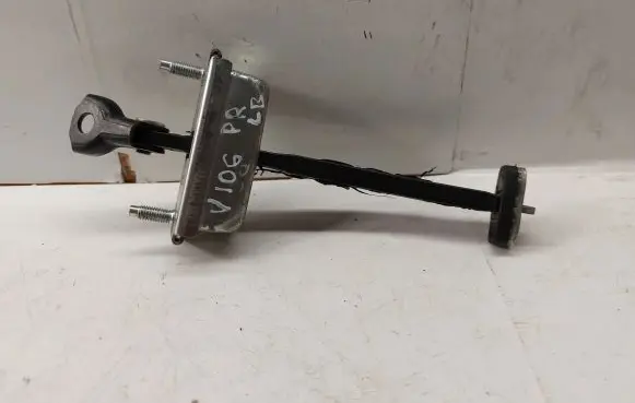 Front door check strap stopper