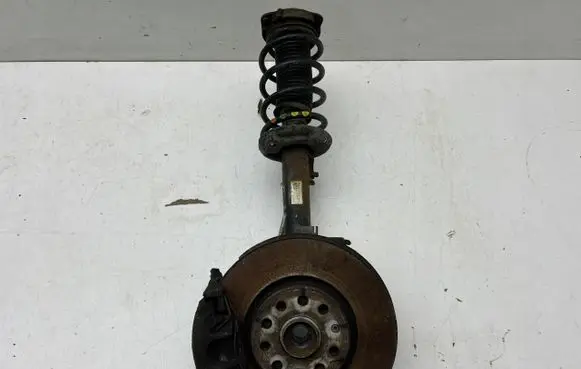 Volkswagen PASSAT B7 Front shock absorber/damper