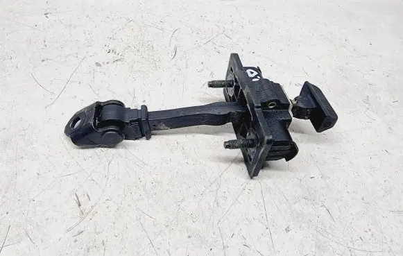Front door check strap stopper