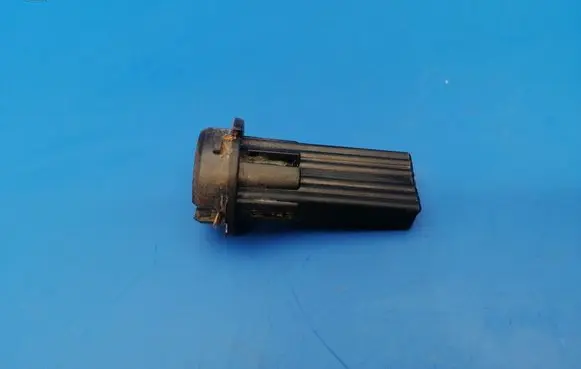 Tail light bulb cover holder