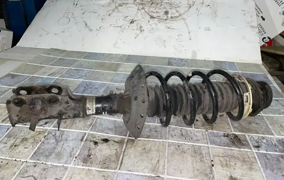 Front shock absorber with coil spring