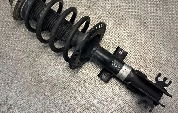Front shock absorber with coil spring