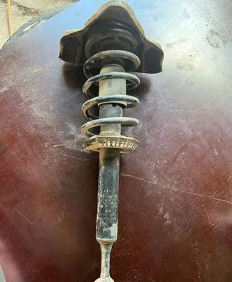 Volkswagen PASSAT B5 Front shock absorber with coil spring 4B0413031A
