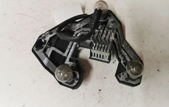 Tail light bulb cover holder