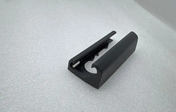 Tesla Model Y Front driver seat rail trim 164155600B