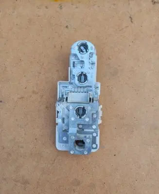 Tail light bulb cover holder