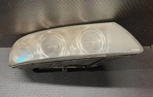 Volkswagen Touareg I Headlight/headlamp 7L6941016BK 89307861