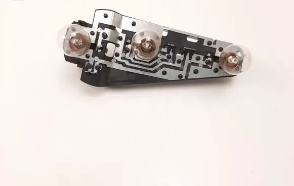 Tail light bulb cover holder
