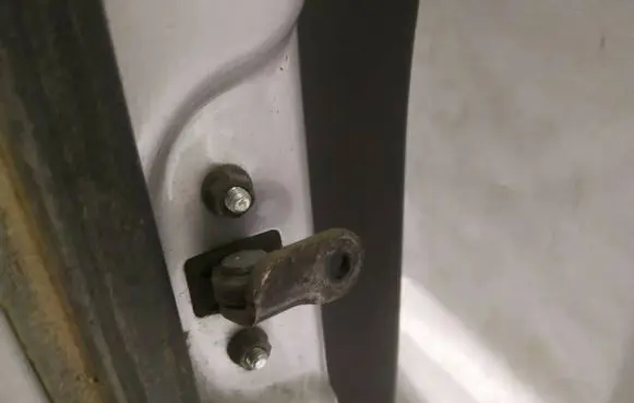 Rear door check strap stopper